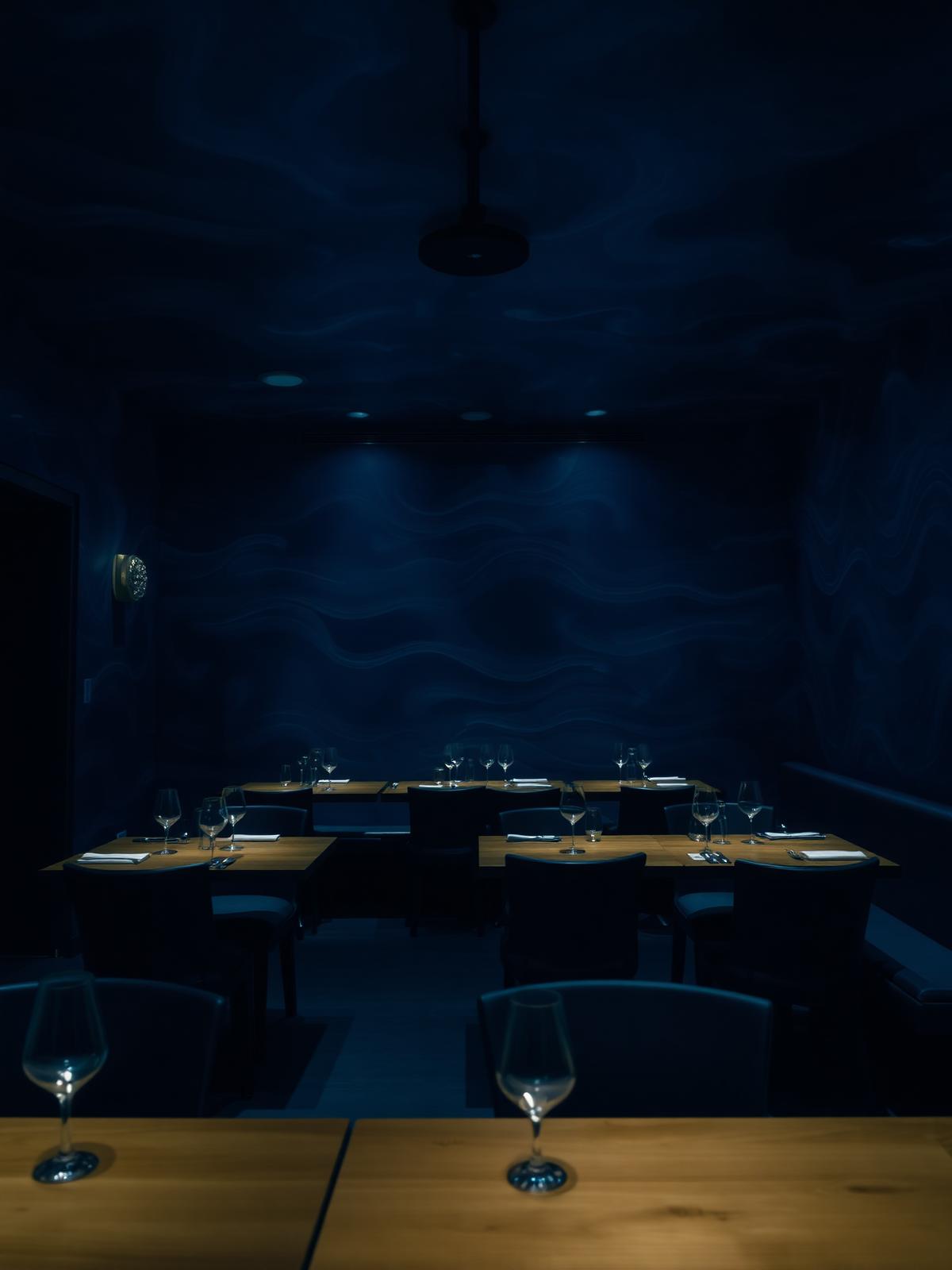 The Fungie Room — dark dining room lit in deep blue